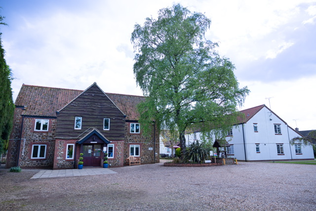 Lower Farm Nursing Home exterior view showing the main building and courtyard