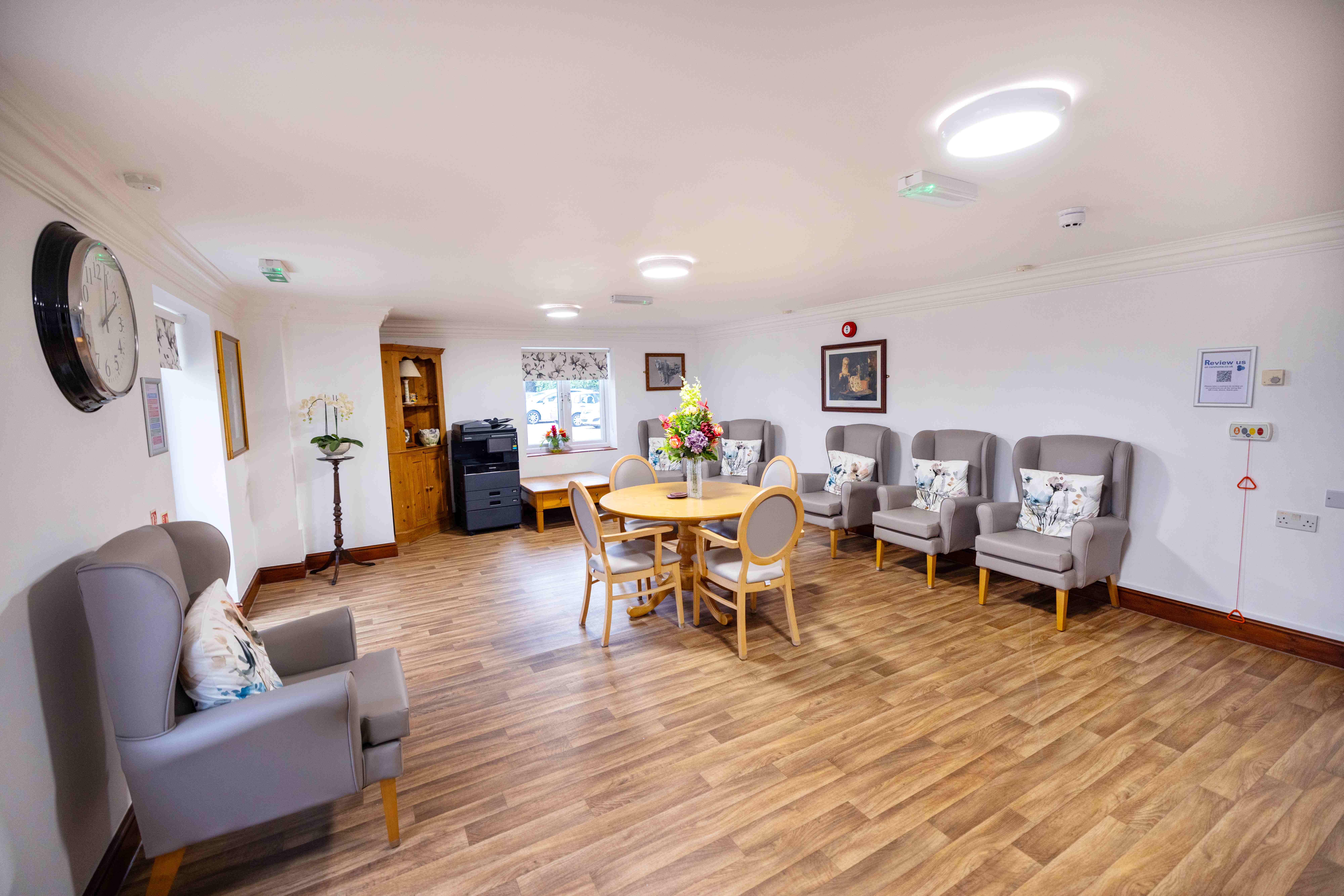 Comfortable lounge with elegant wingback armchairs and warm lighting